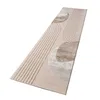A long, rectangular rug with a geometric abstract pattern, laid out flat on a white background. Produktbild-Vorschau