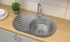 A stainless steel kitchen sink with a faucet and a draining board, placed on a wooden countertop. Produktbild-Vorschau