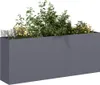 A long, rectangular planter filled with green plants and some yellow and purple flowers, set against a white background. Produktbild-Vorschau