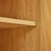 A close-up view of a wooden shelf and the wooden wall of a cabinet. Náhľad obrázku produktu