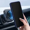 A hand holding a dark blue phone case with a phone inside, attached to a car vent mount. Produktbild-Vorschau