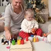 Giocattolo montessoriano in legno "Bambolina con tappo in Anteprima dell’immagine prodotto 2