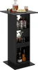 A black bar table with shelves filled with bottles and glasses, and a decanter, glasses, and cake on top. Produktbild-Vorschau