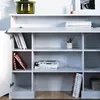 A white bookshelf filled with books and a plant. Náhled obrázku produktu