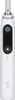 A white electric toothbrush with a black control panel. Náhled obrázku produktu