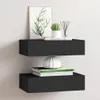 Two black floating shelves mounted on a white wall, decorated with books, a plant, and a vase. Produktbild-Vorschau