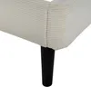Close-up of the bottom corner and leg of a bed frame covered in beige corduroy fabric with thin gray stripes. A black cylindrical leg is visible. Produktbild-Vorschau