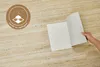 Selbstklebende Designfliesen in Marmoroptik Beige, ausgelegt auf weißem Untergrund.  Produktbild-Vorschau