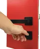 A hand is shown operating a black door handle on a red door. Produktbild-Vorschau