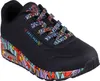 A black Skechers sneaker with a colorful, abstract design on the sole and laces. Náhled obrázku produktu