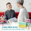 A mother and son exchanging a gift, with product packaging and containers visible. Produktbild-Vorschau