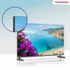 A Thomson 4K Ultra HD Smart Android TV displaying a scenic coastal image, with a close-up inset of the TV's corner. Produktbild-Vorschau