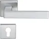 A silver-colored door handle set with a keyhole escutcheon plate, presented on a white background. Produktbild-Vorschau