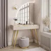 A vanity table with a mirror, stool, and decorative items in a room. Náhľad obrázku produktu