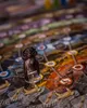 A close-up of a board game with a miniature figure on it. Náhled obrázku produktu