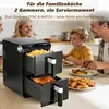 A family is sitting at a table, with a dual-chamber air fryer in the foreground. The air fryer contains french fries in the top drawer and a roasted chicken in the bottom drawer. Food is also on the plates in front of the family. Anteprima dell’immagine prodotto