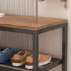 A close-up view of a shoe rack with shoes on it, against a striped background. Náhľad obrázku produktu