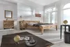 A bedroom with a bed, dresser, and nightstand made of natural wood, decorated in a rustic style. Produktbild-Vorschau