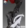 A close-up view of a statue's feet and base, featuring a character's black boots standing on a rocky terrain with a stylized Avengers 'A' logo. Náhled obrázku produktu