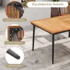 A close-up view of a wooden garden table with black metal legs, showcasing its construction details and materials. Produktbild-Vorschau