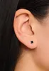 Close-up of a woman's ear wearing a small stud earring. Anteprima dell’immagine prodotto