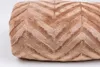 A close-up of a brown blanket with a chevron pattern. Podgląd zdjęcia produktu