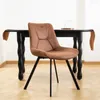 A brown upholstered dining chair with black metal legs is placed in front of a black dining table. Podgląd zdjęcia produktu