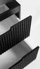 A close-up view of two open drawers of a black cabinet, showing their ribbed fronts and white interiors. Produktbild-Vorschau