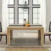 A dining table set up in a dining room with chairs, a chandelier, and decorative items on the table. Náhled obrázku produktu