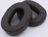 Two brown headphone ear pads are shown on a white background. Podgląd zdjęcia produktu