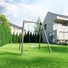 A backyard scene with a swing set in the foreground and modern houses in the background. Produktbild-Vorschau