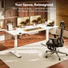 A modern home office setup with a white standing desk, dual monitors, a laptop, and an ergonomic chair. Anteprima dell’immagine prodotto