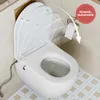 A white toilet seat with a bidet function is shown in a bathroom setting. The lid is partially open, demonstrating its slow-closing mechanism. Produktbild-Vorschau