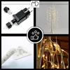 A collage of images showing details of a decorative LED tree, including its power adapter, base, and close-ups of the lights and branches. Podgląd zdjęcia produktu