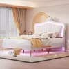 A bedroom scene featuring a white upholstered bed with a crown-shaped headboard and LED lighting. Náhled obrázku produktu