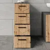 A tall, narrow cabinet with four drawers is shown in a bathroom setting, next to a wall with large gray tiles. Voir les images du produit