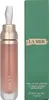 A product shot of a lip volumizer and its packaging. Podgląd zdjęcia produktu