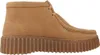 A side view of a brown leather clog. Voir les images du produit