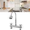 A kitchen faucet is shown in the foreground, with a kitchen scene in the background. Podgląd zdjęcia produktu
