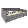 A gray upholstered daybed with a pull-out trundle bed is shown from a side-angle. Anteprima dell’immagine prodotto