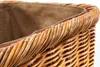 A close-up view of the top edge of a woven rattan basket, showing the texture of the material and the fabric lining inside. Produktbild-Vorschau