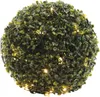 A close-up, studio shot of a green, spherical artificial plant ball decorated with warm white LED lights. Produktbild-Vorschau