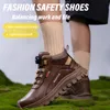 A close-up shot of a person's legs wearing brown safety boots and beige socks, standing on a mossy surface. Produktbild-Vorschau