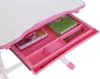 A close-up view of an open drawer of a child's desk, showing various stationery items. Produktbild-Vorschau