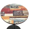 A round table with a wood-like patterned top and a black metal base, shown against a white background. Produktbild-Vorschau