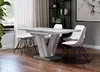 A dining room setting with a table and chairs. Produktbild-Vorschau