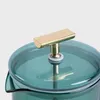 Close-up of the lid and handle of a teal-colored pitcher or teapot. Produktbild-Vorschau
