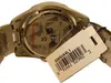 The back of a silver watch with a price tag attached. Voir les images du produit