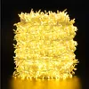 A tightly wound coil of yellow LED string lights against a black background. Produktbild-Vorschau