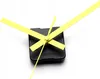 A close-up shot of a clock mechanism with yellow hands against a white background. Produktbild-Vorschau